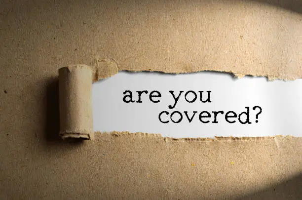 the role of an executor in the probate process is vital, torn paper with word are you covered