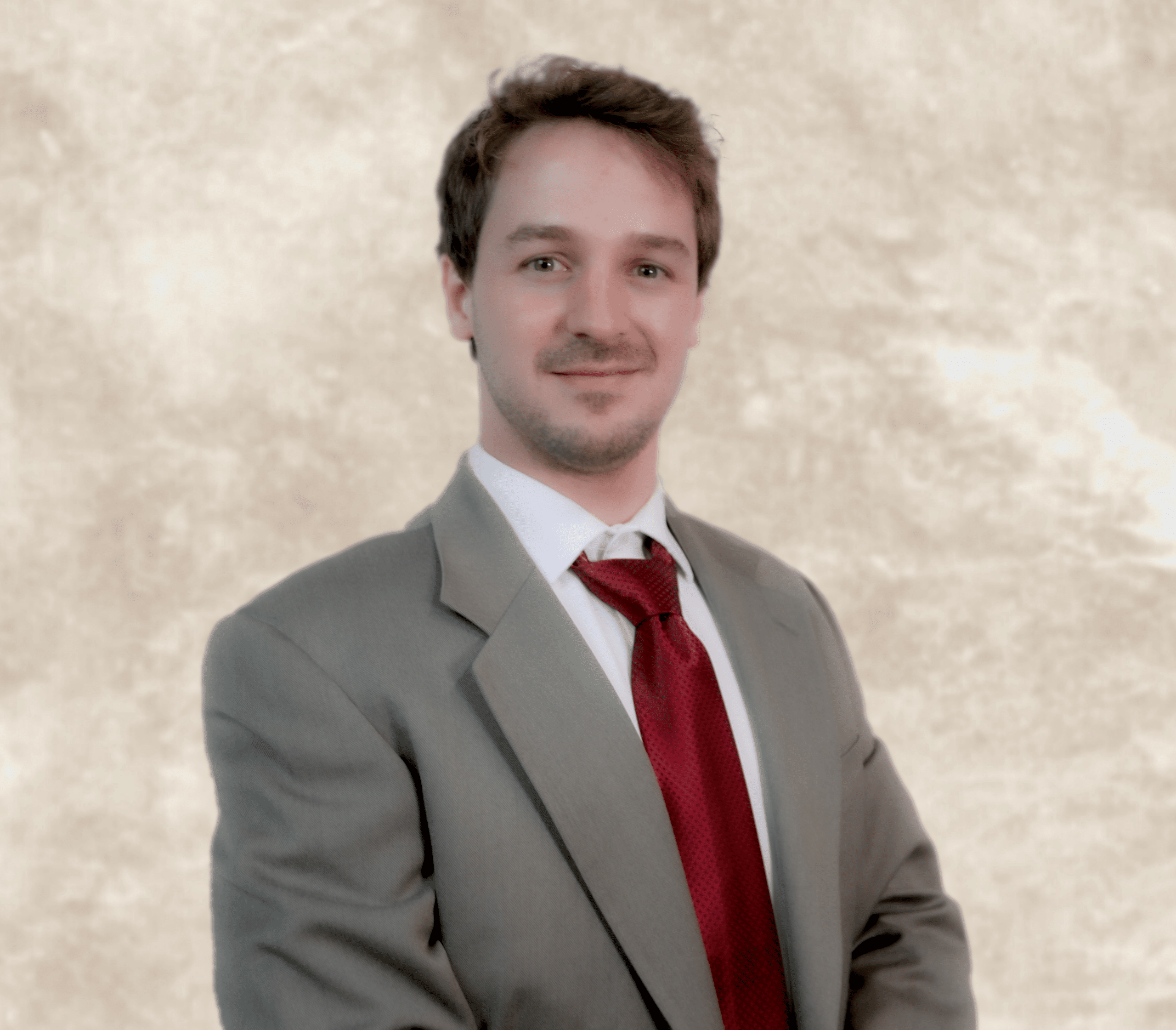 Michael Edwards, compassionate family law and probate attorney, wearing a gray suit and red tie, smiling against a neutral background.