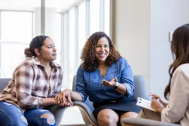 probate real estate is a complex arena requiring legal knowledge, logistical precision, and often delicate interpersonal negotiation, daughter listens while mom talks to unrecognizable female counselor