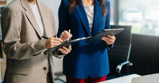 the role of an executor in the probate process is vital, businessman and team analyzing financial statement finance task with smart phone and laptop