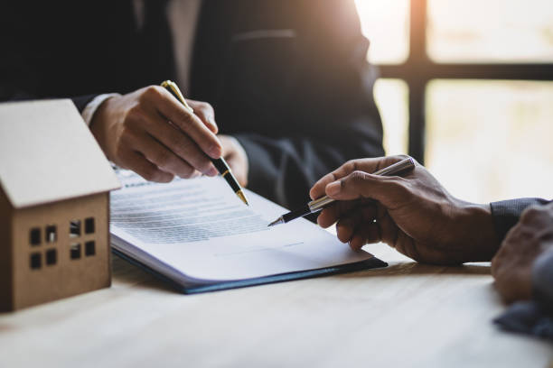 inheriting property after the death, businessmen and real estate agents discussing documents signing a legal purchase of a house