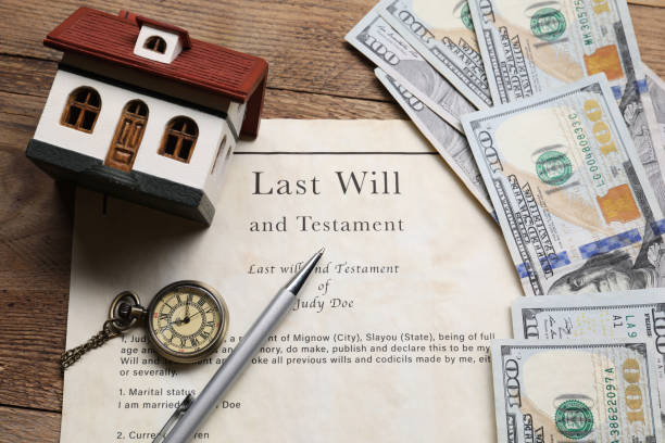Last will and testament document with a miniature house, dollar bills, a pocket watch, and a pen on a wooden table, symbolizing estate planning and asset distribution in Texas.