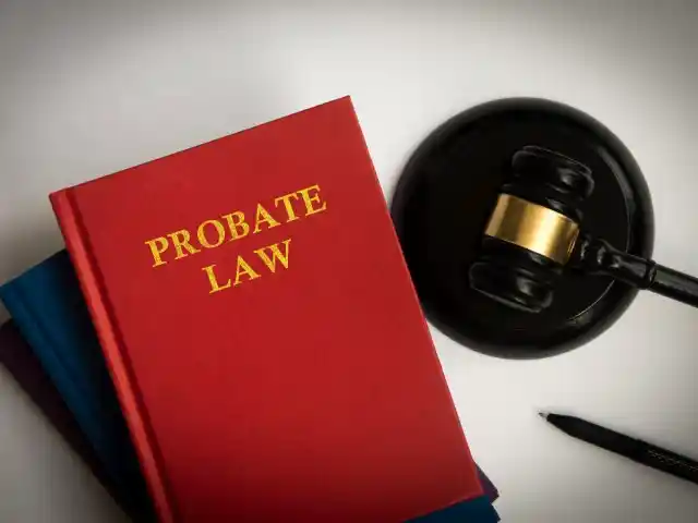 Red book titled "PROBATE LAW" alongside a gavel and pen, symbolizing legal processes related to probate and estate planning in Texas.