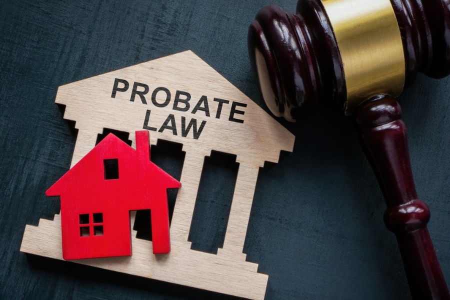 Wooden probate law sign with house icon and gavel, symbolizing estate planning and legal processes in Texas probate.