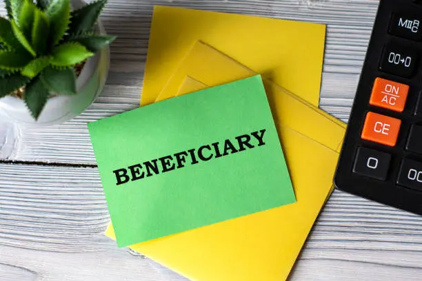 managing real estate during the probate process in texas can be complex, beneficiary words on green paper on the background of a calculator and a cactus