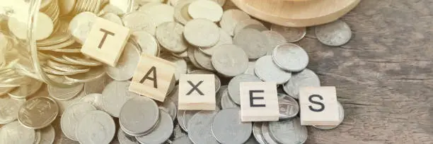 probate is never a simple process, but it can feel like navigating an entirely different world for texas ranchers, taxes text on wood block on money coin