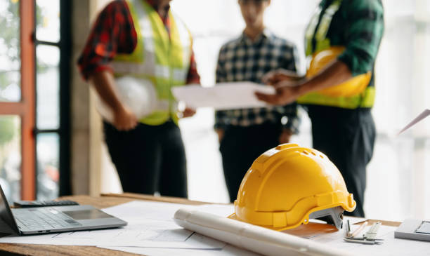 flipping houses is one of the most lucrative ways to make money in real estate, and texas has become a prime destination for investors looking to turn old, distressed properties into profitable sales, engineer teams meeting working together wear worker helmets hardhat on construction site in